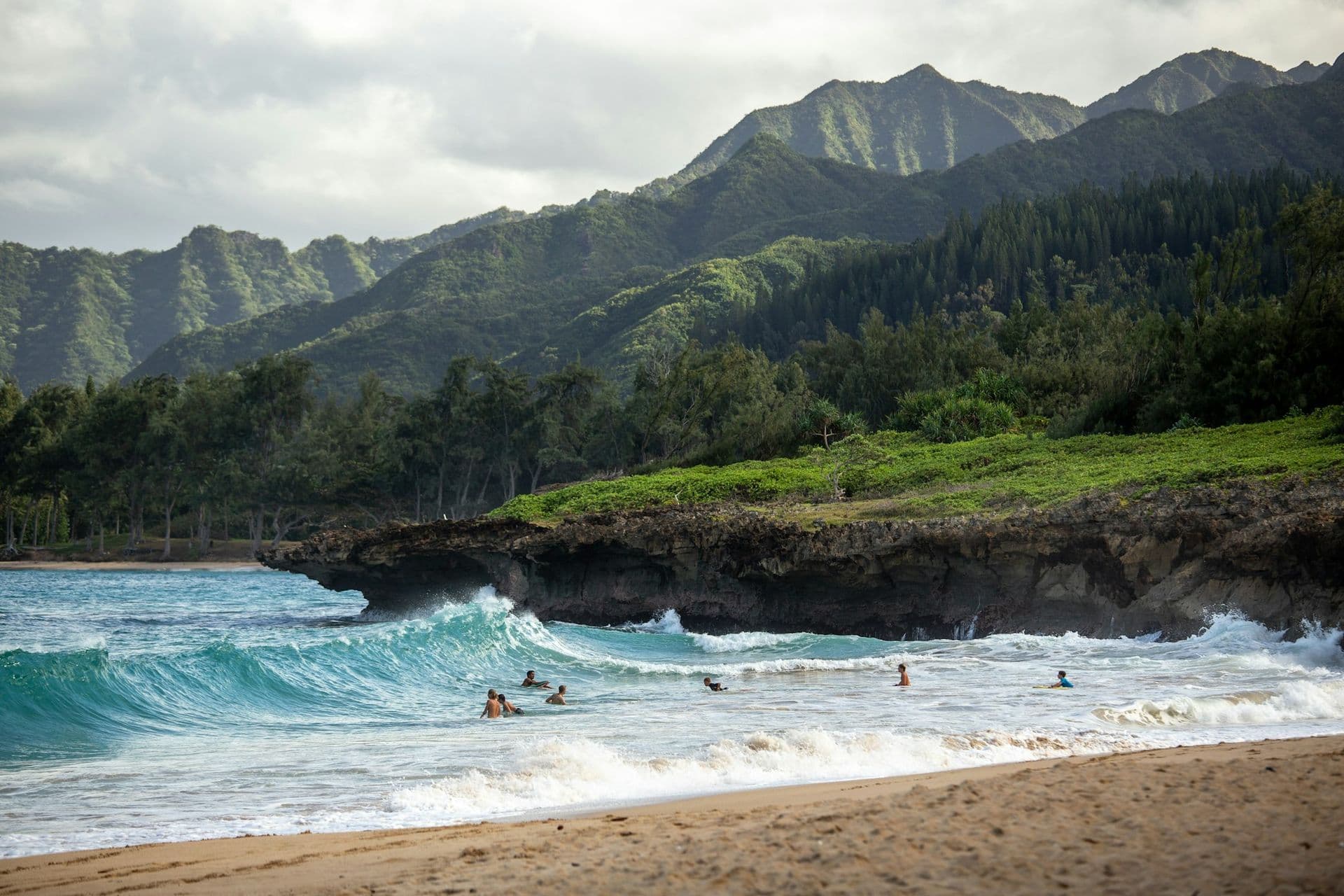 Kauai coastline with lush green mountain ridges